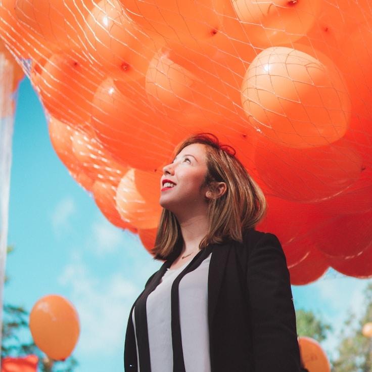 Kaveri Mehta, Lead Design Curator at Green Plaza Frame, reviewing corporate floral arrangements